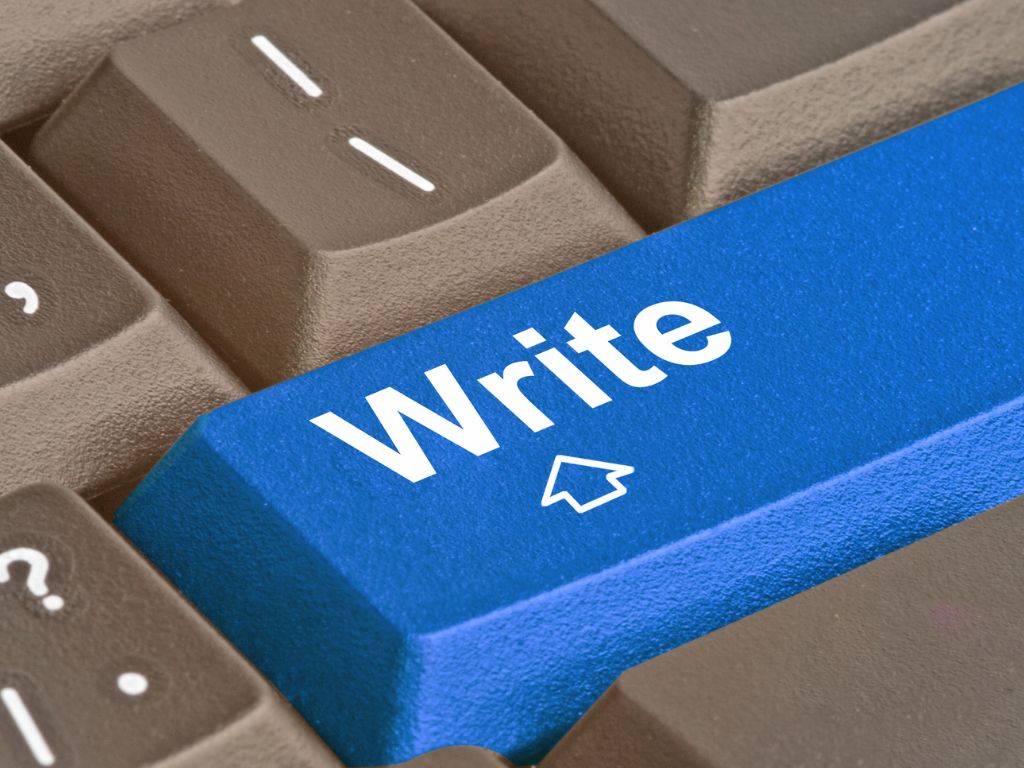 Klawisz 'Write' na klawiaturze, symbolizujący proces tworzenia treści i efektywność copywritingiem wspomaganego przez AI.